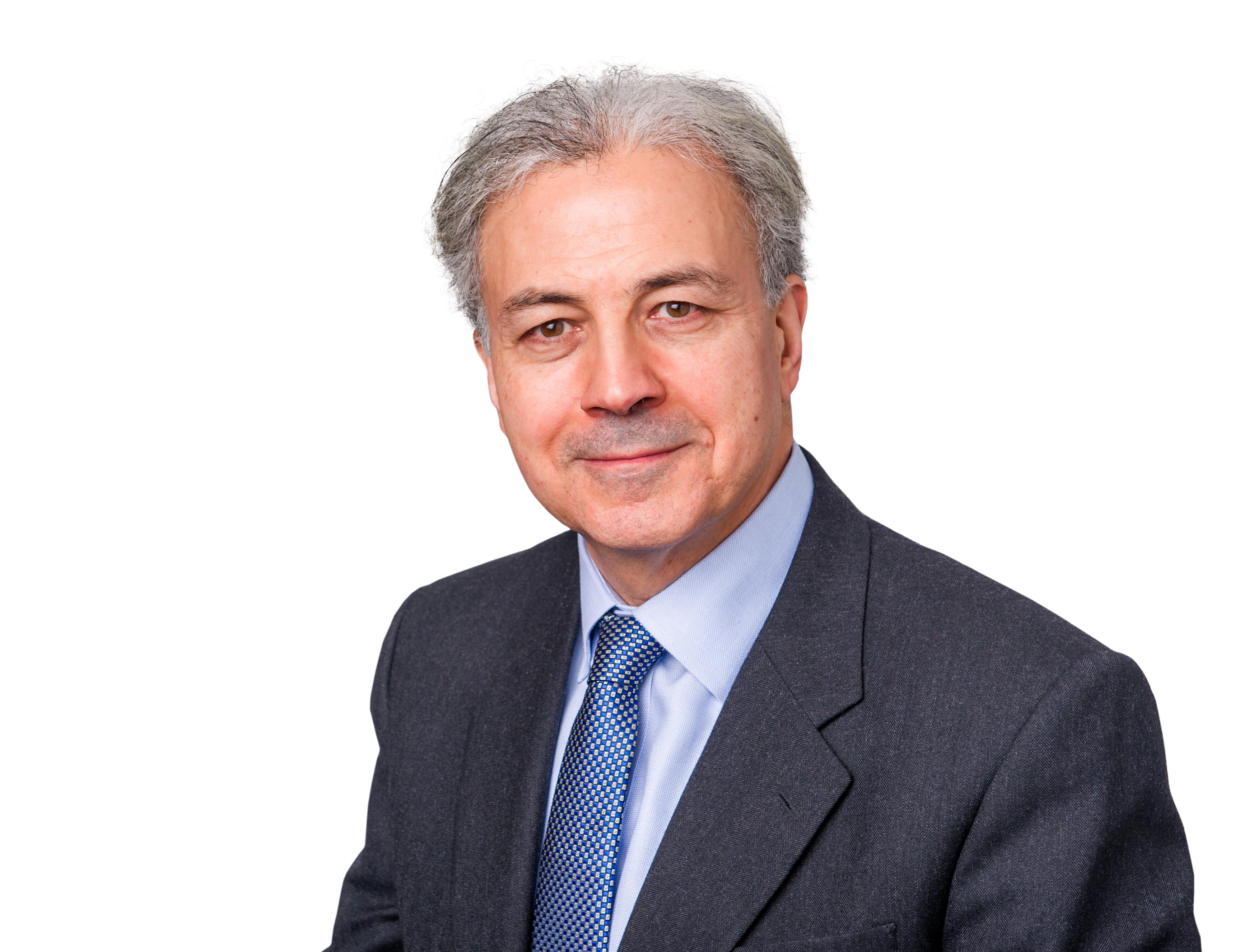 Saker Nusseibeh in a blue suit and blue tie.